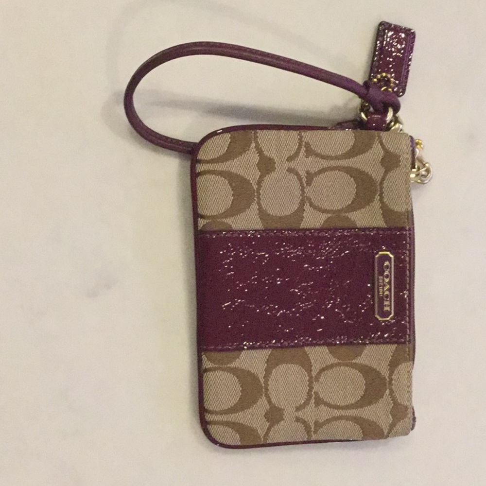 Stunning Coach Wristlet w leather accent.